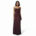 Burgundy evening gown with a slit on a white background